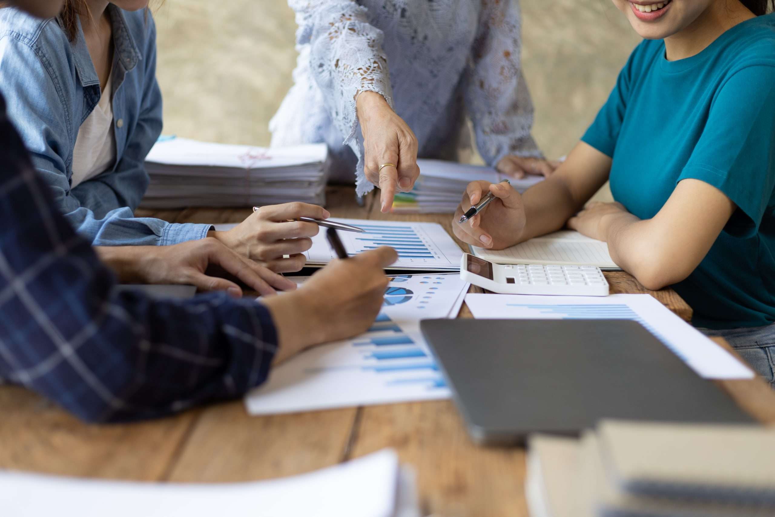 Colleague working together in meeting room, brainstorming group of people working concept. Business team, Marketing plan researching, analyzing investment chart and planning business strategy.