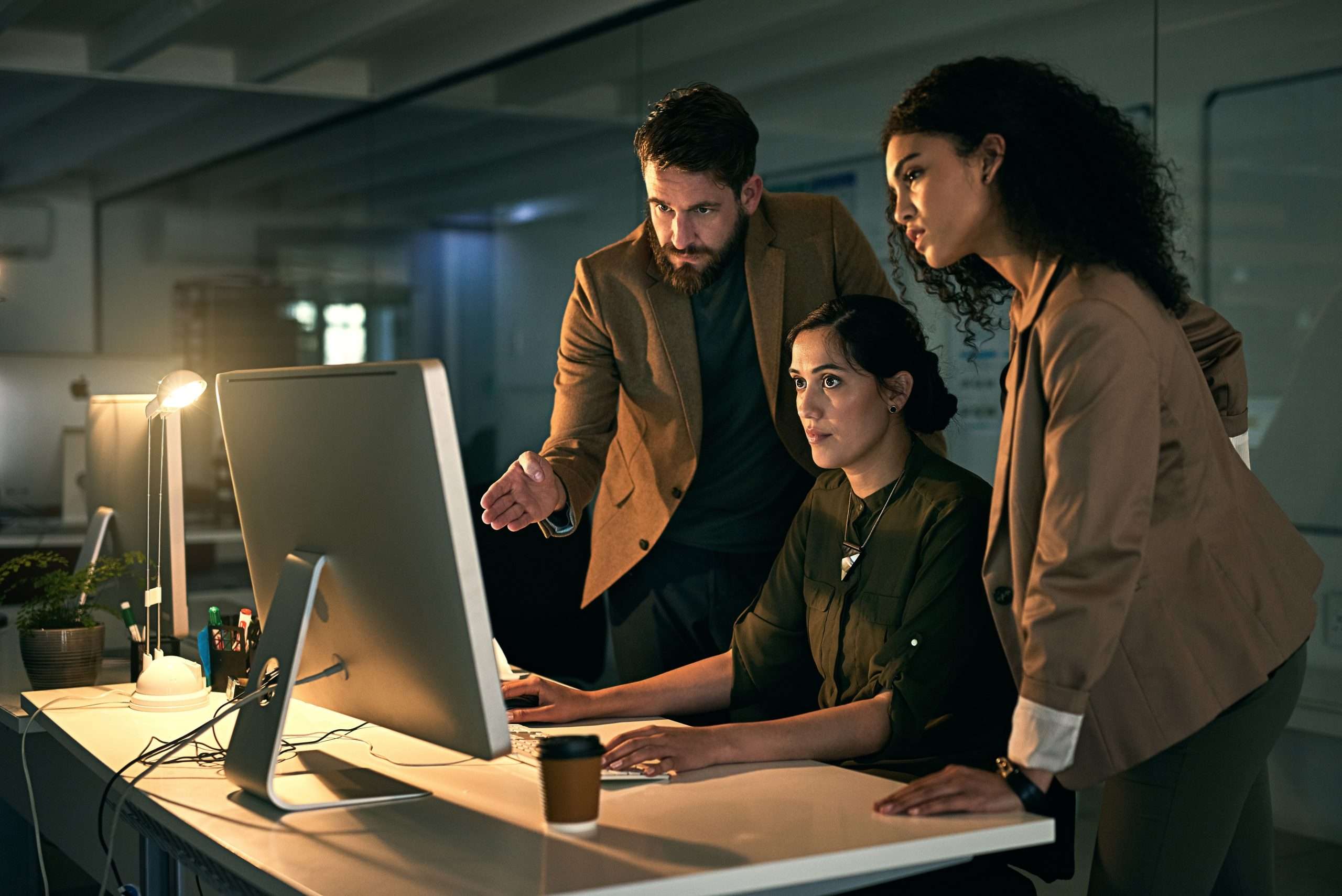 Putting in the extra time to achieve success. Cropped shot of colleagues working late